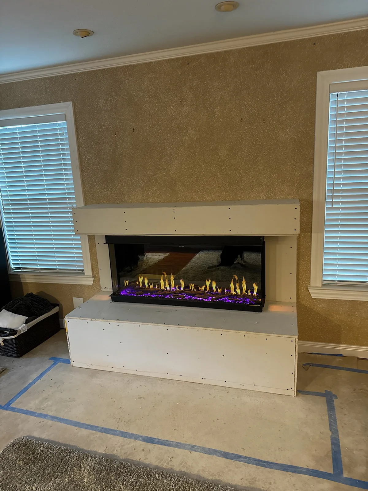 Electric fireplace installed in a bright living room wall Electric fireplace installed in a bright living room wall